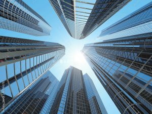 modern corporate buildings in city downtown district with sun stockpack adobe stock